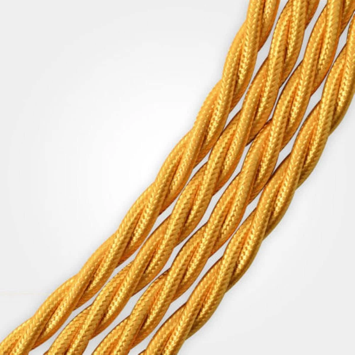 Close-up of 5m twisted 2 core light gold fabric braided cable with vintage style for indoor lighting use