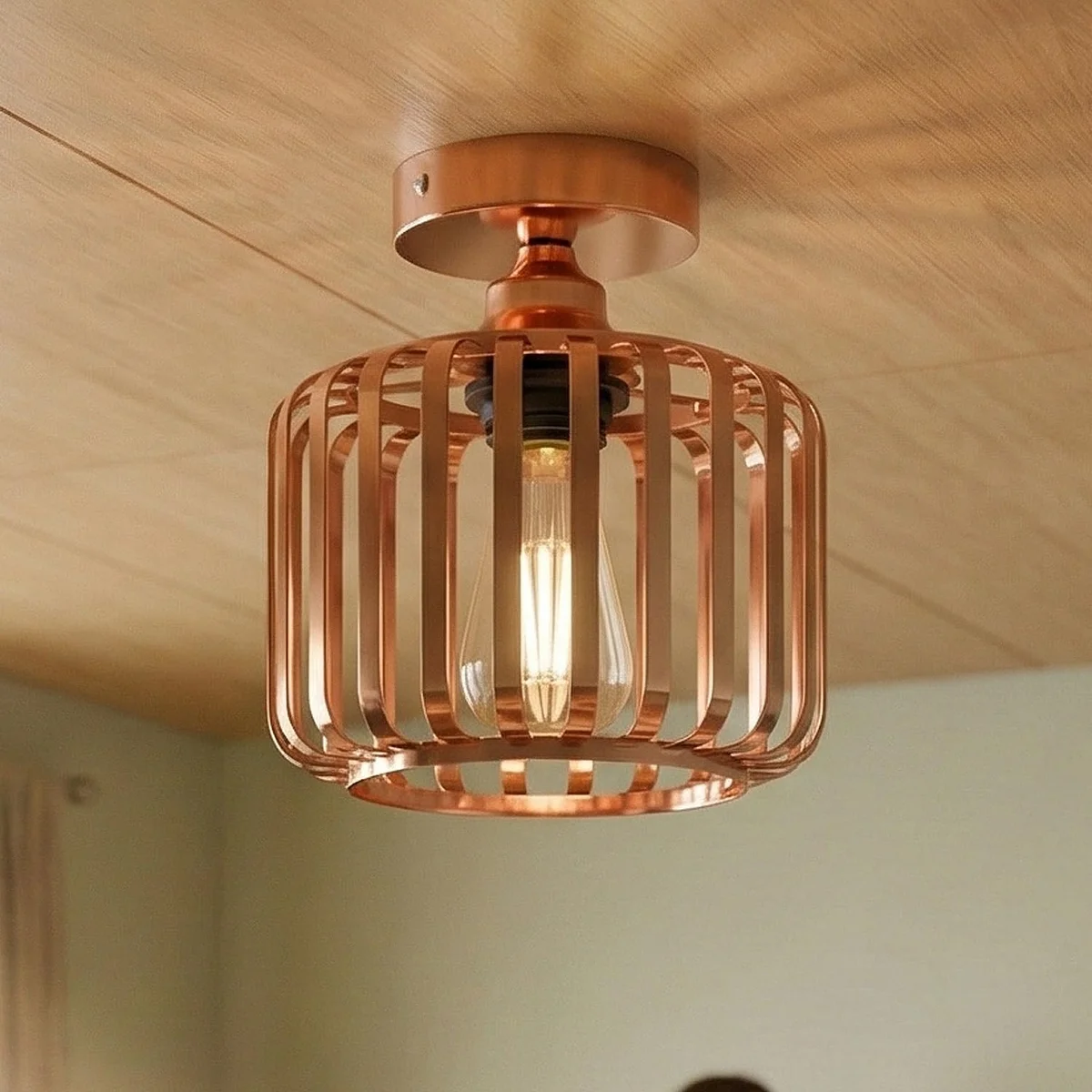 Rose gold industrial cage ceiling light with metal cage shade and semi-flush mount design for modern interiors
