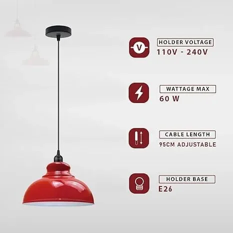 Three metal dome kitchen island pendant lights in brushed brass finish hanging at different heights over a kitchen island