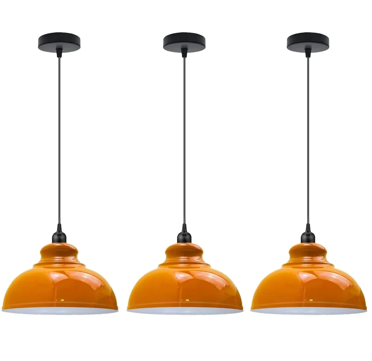 Three metal dome 3 pack pendant lights in brushed brass finish hanging over a kitchen island with adjustable cords