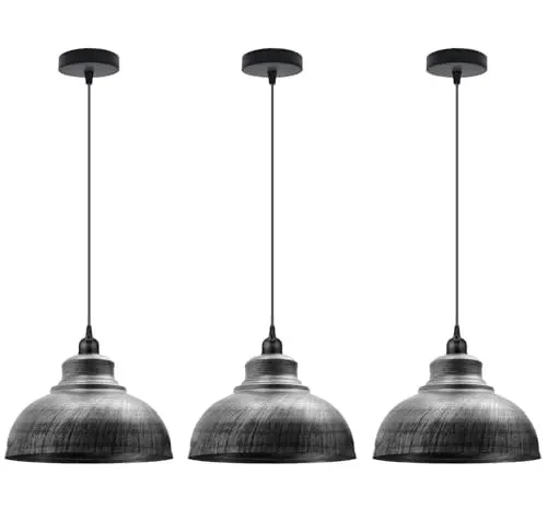 Three modern metal pendant lighting fixtures with curved shades hanging in a row with adjustable cords in brushed brass finish