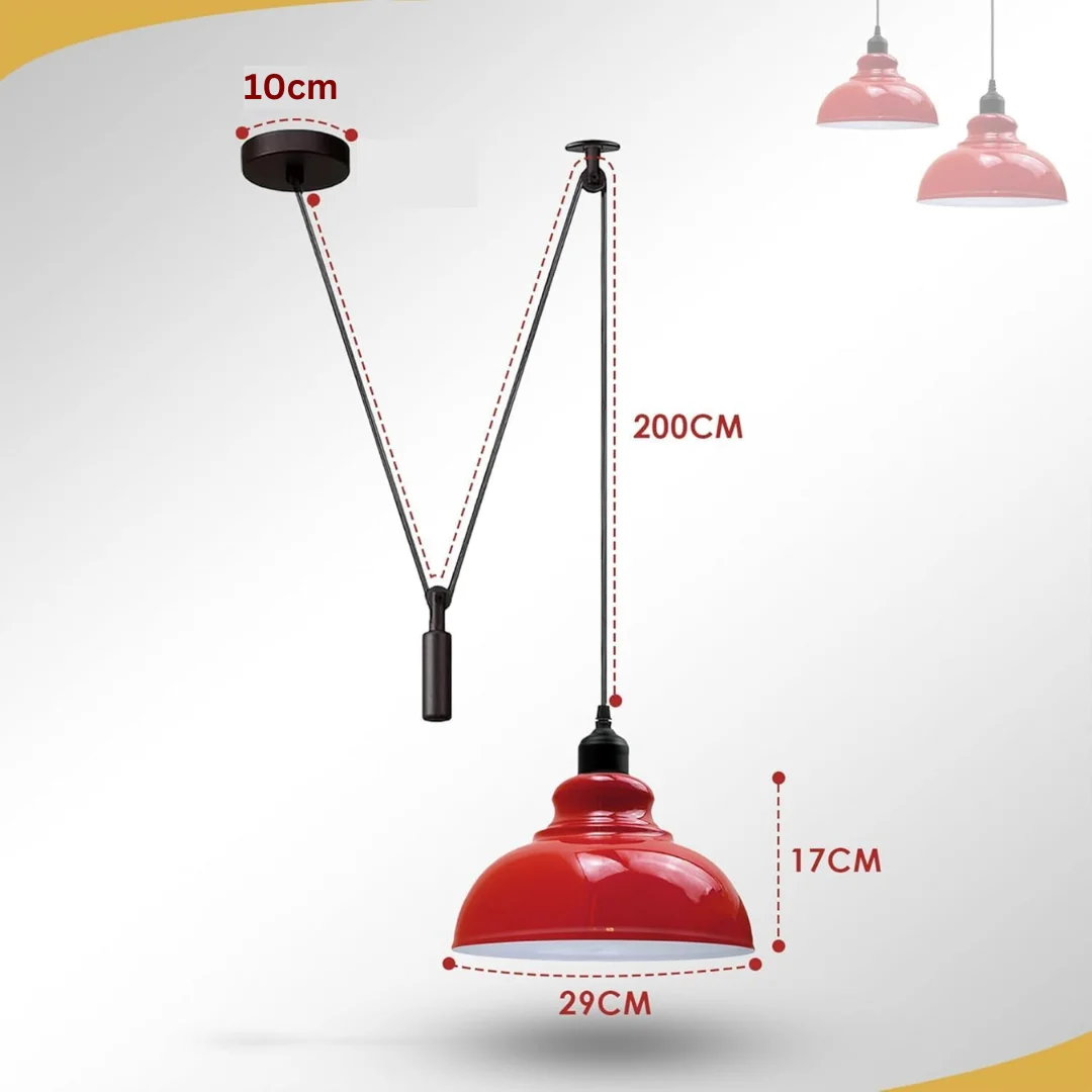 Adjustable industrial pendant light with metal pulley system and spider-style ceiling mount hanging over wooden surface