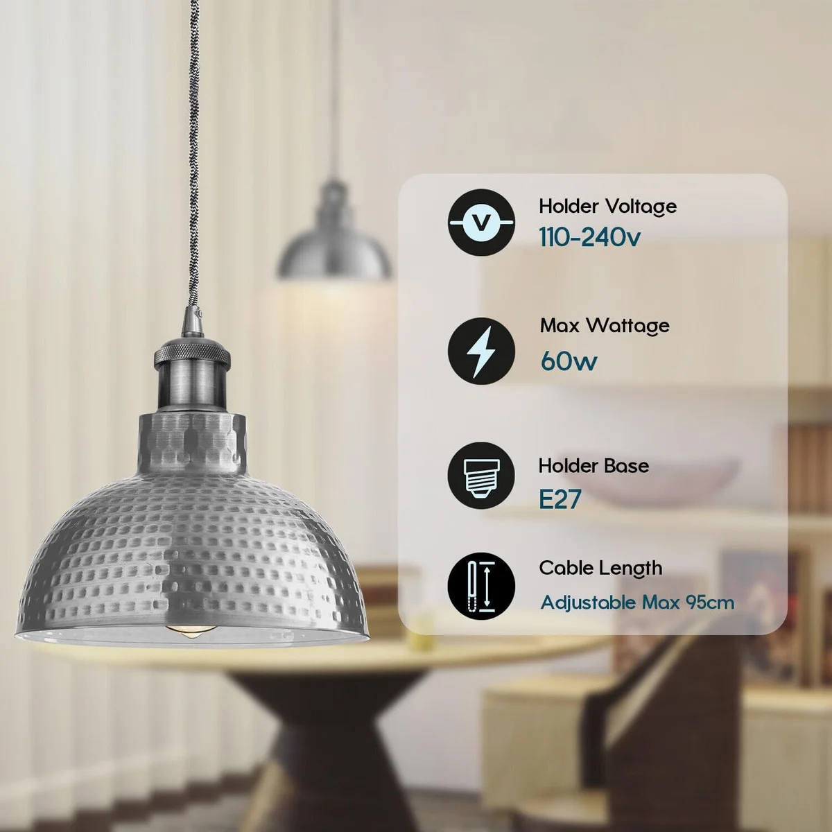 Three adjustable metal pendant lighting fixtures with oxidized finish hanging over a dining table in industrial style