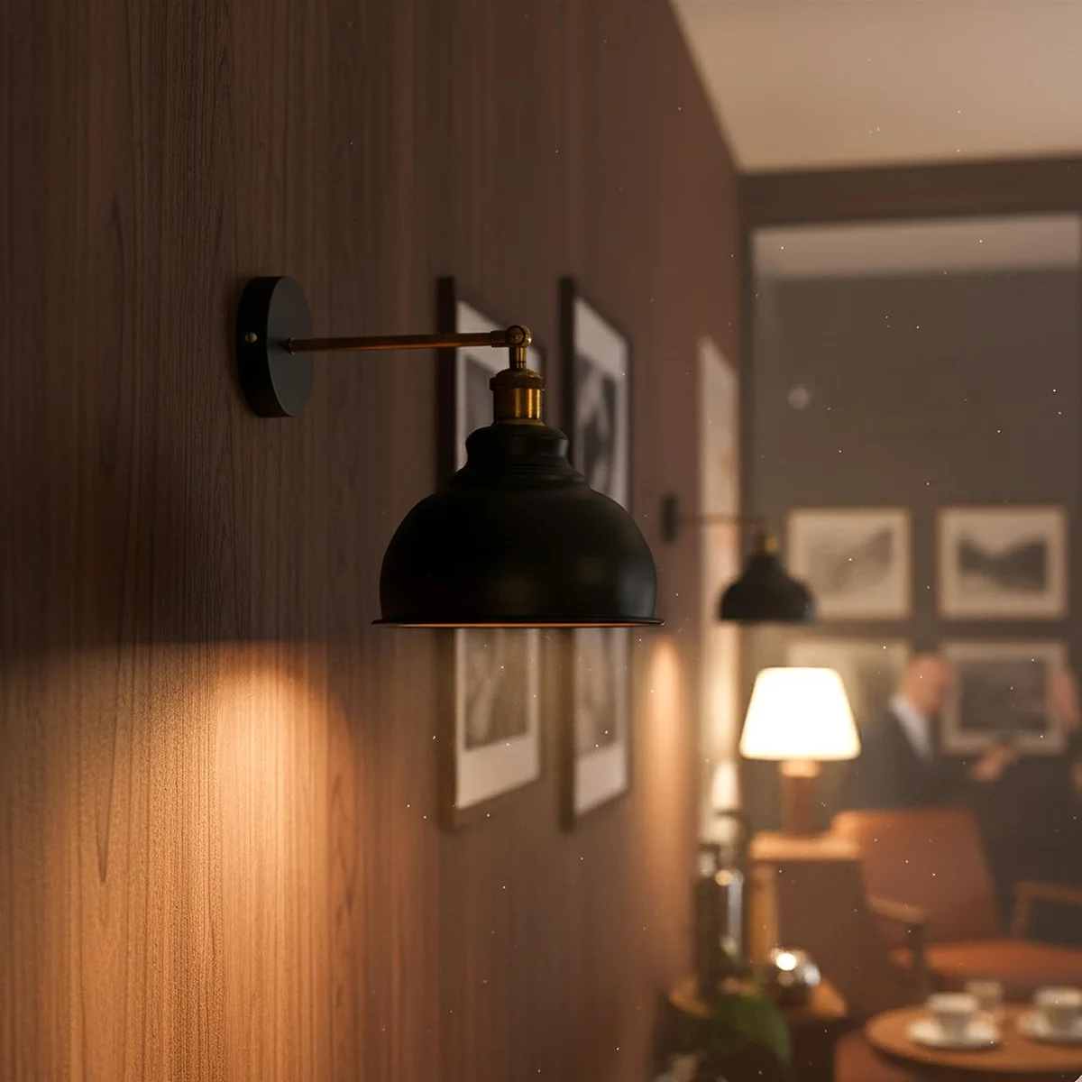 Matte black industrial adjustable arm sconce with dome shade extending 18cm from wall, mounted on a slim wall plate