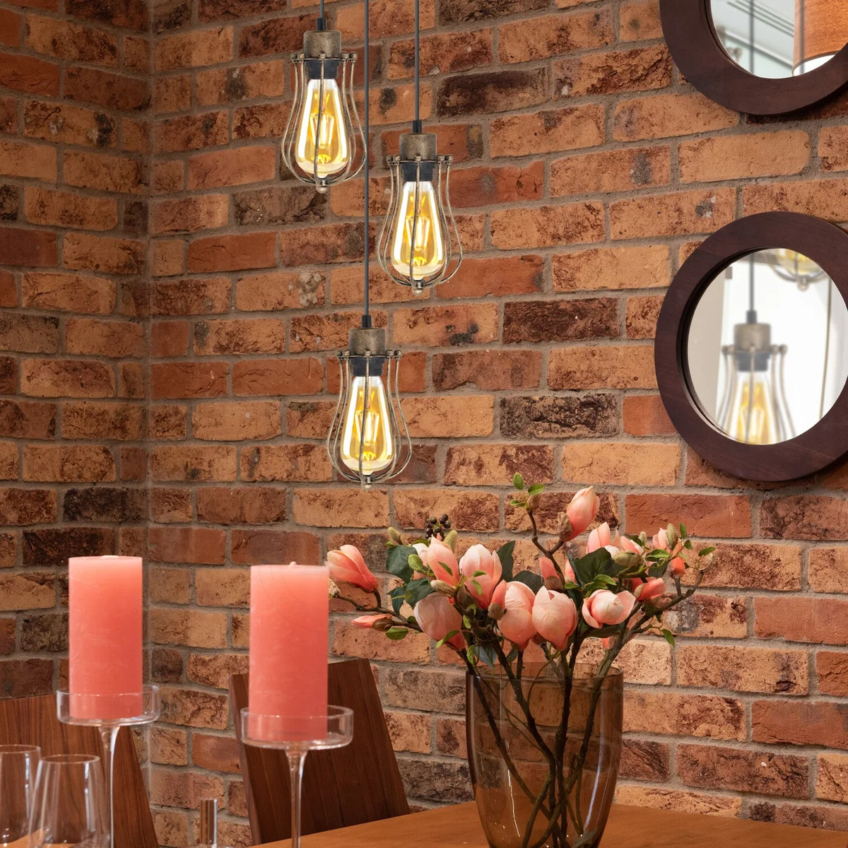 Vintage industrial ceiling pendant light with three balloon-shaped metal wire cage lampshades hanging from round ceiling plate