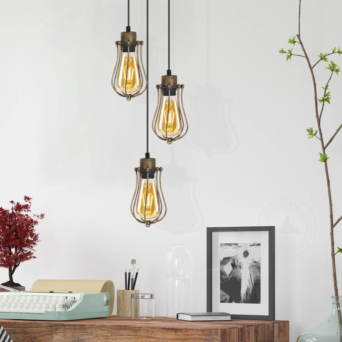 Three balloon-shaped metal wire cages hanging from a round ceiling plate vintage industrial ceiling pendant light