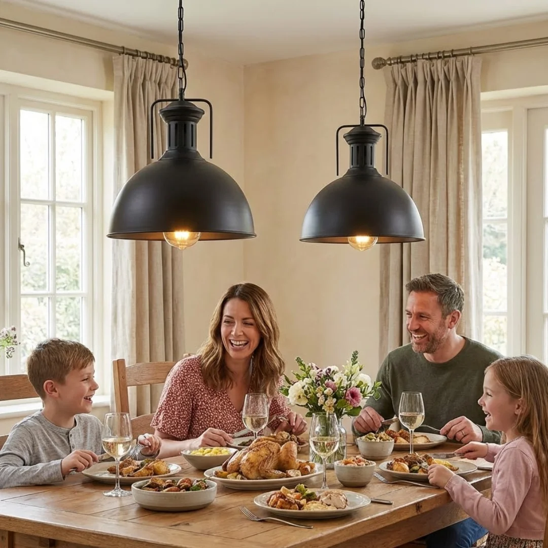 Black metal dome pendant light with chain hanging against a white background, showcasing industrial farmhouse style design