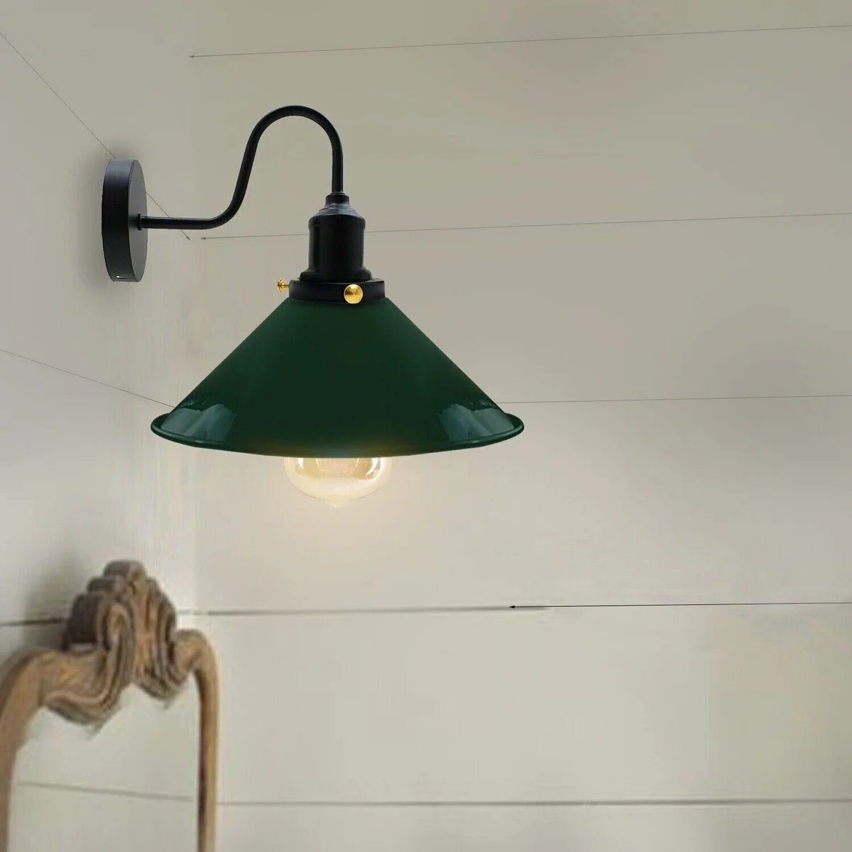 Vintage industrial wall sconce with adjustable metal cone shade in black finish mounted on white wall, E27 bulb included