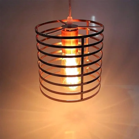 Rose gold pendant light with adjustable fabric cable and industrial metal cage shade hanging against white background