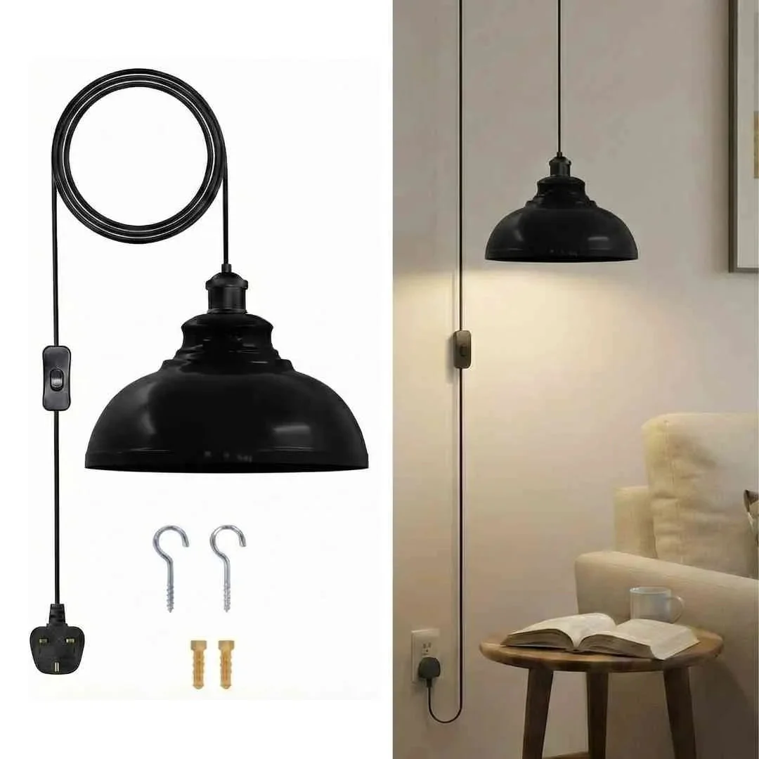 Vintage metal plug in pendant light with curvy shade, black cord, and on/off switch against white background
