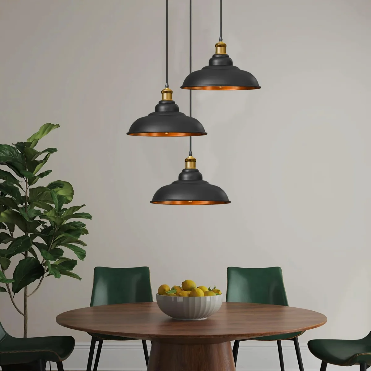 Set of 3 pack pendant lights with black metal shades and gold interiors, vintage style, hanging in a row against white background