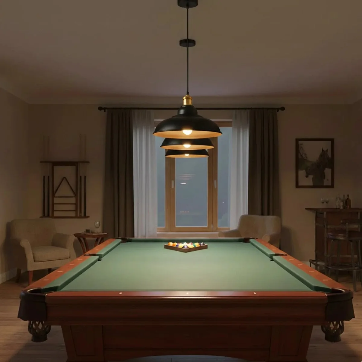 Three black pendant light fittings with metal shades and gold interiors hanging in a row against a white background