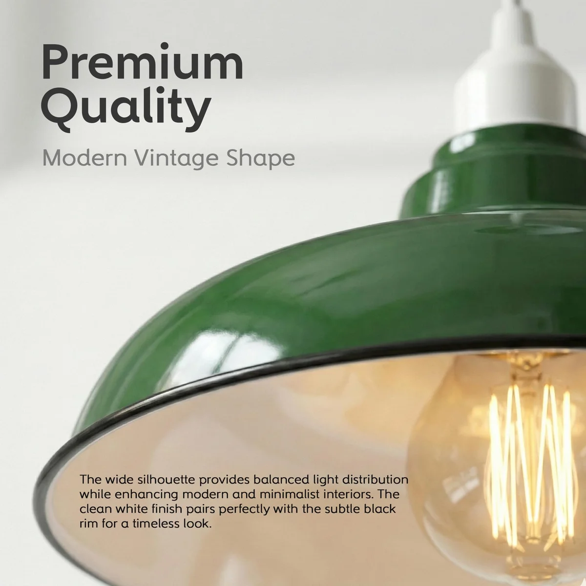 Green metal easy fit pendant shade with black rim hanging against white background, showing curved retro design