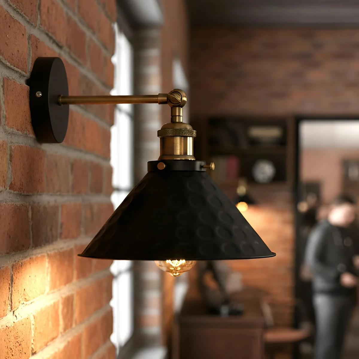 Black vintage wall sconce with metal cone shade and 180-degree adjustable arm for indoor use