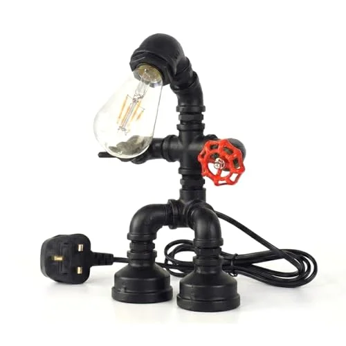 Vintage desk lamp with black metal water pipe design, red valve, and umbrella-style shade on wooden table surface