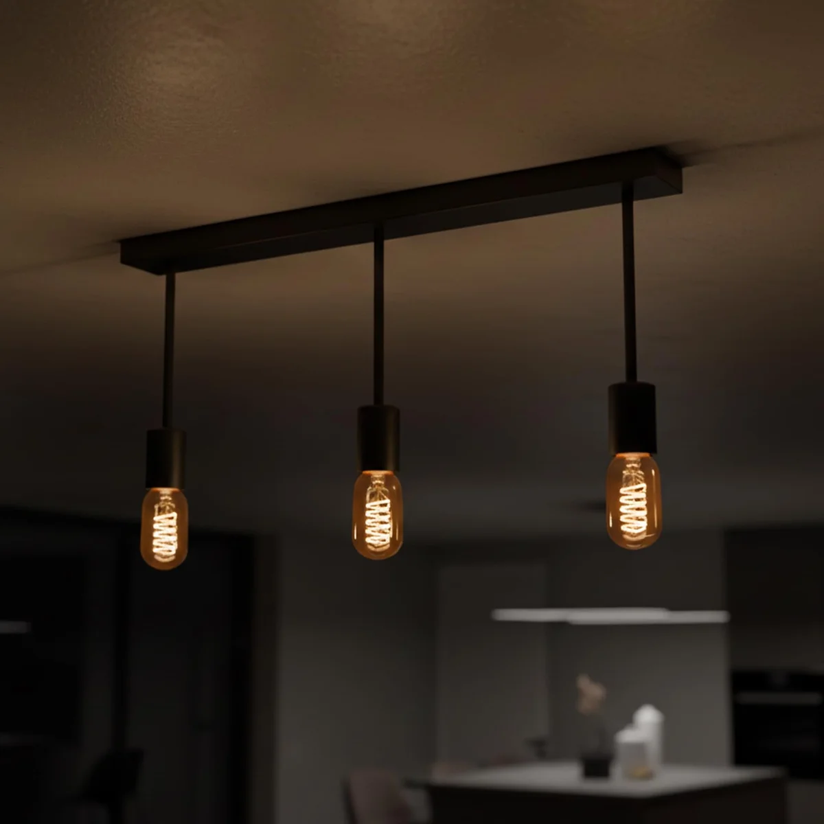Modern industrial 3 light ceiling pendant with three exposed bulbs and round metal base, suitable for kitchen or dining room