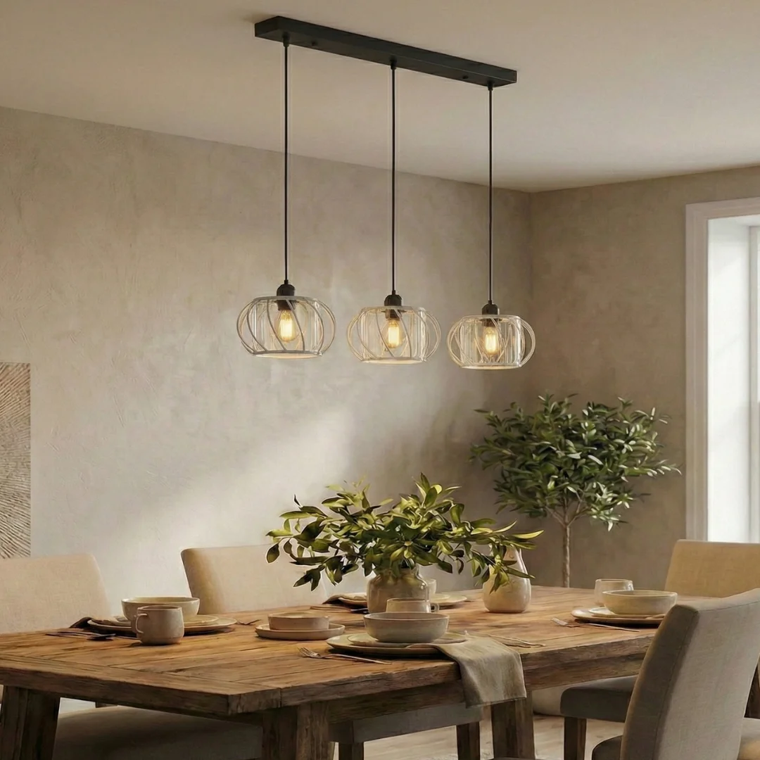 3 light pendant lamp with black metal frame and three clear crystal glass shades hanging in a linear design