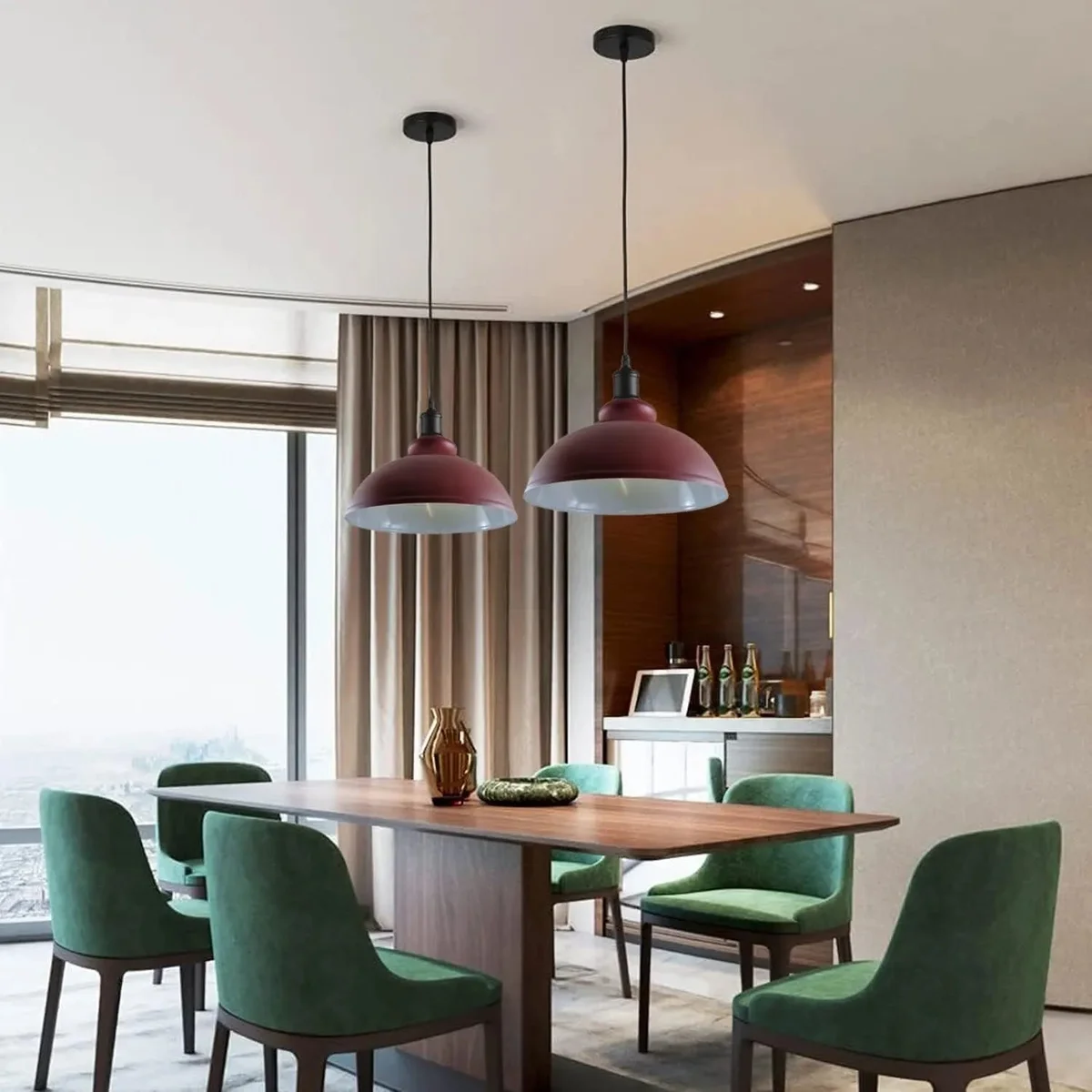 Two modern metal pendant lights with adjustable cables and E27 base pendant light bulbs hanging over a wooden table