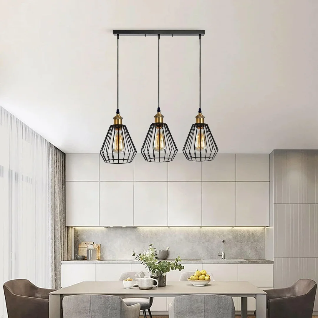 Three matte black diamond-shaped metal cages on adjustable cables in industrial pendant lighting style with E27 sockets