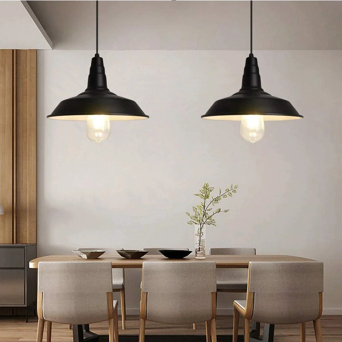 Black industrial vintage style pendant light with curvy pearl dome and adjustable hanging cable on white background