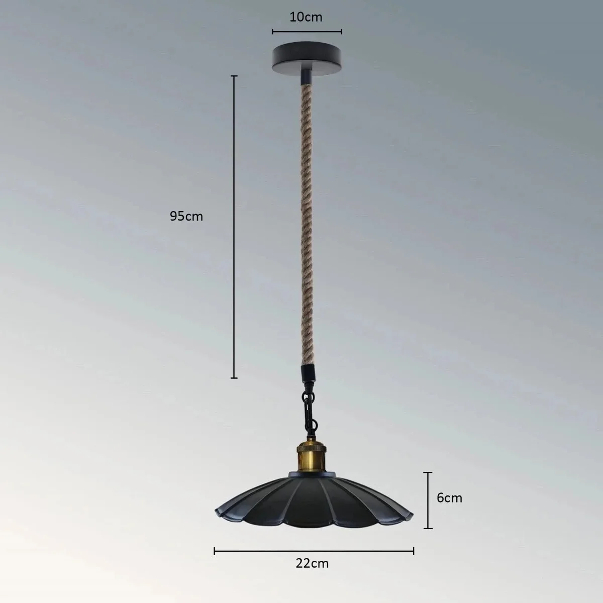 Scalloped metal shade industrial pendant light with jute rope cord and brushed copper interior hanging from ceiling