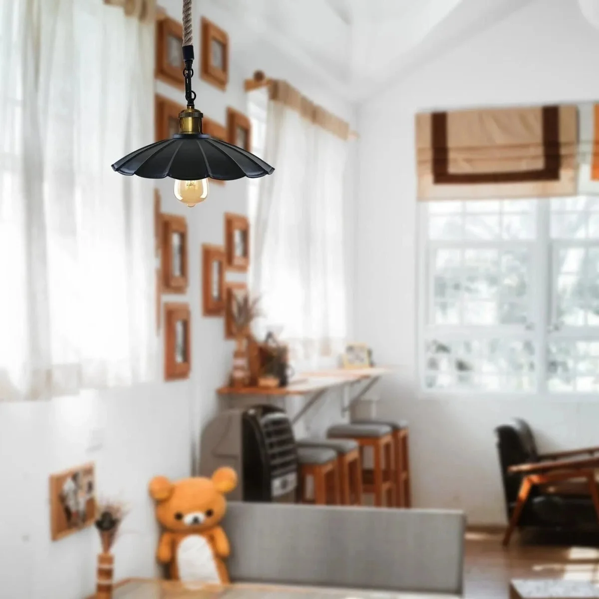 Vintage pendant light with scalloped metal shade and adjustable jute rope hanging against a white background