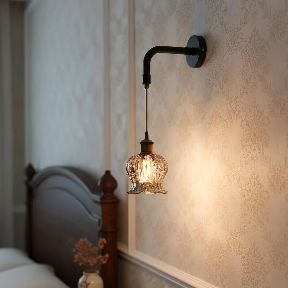 Modern industrial pendant light with textured glass globe lamp, matte black finish, and twisted fabric cord hanging from ceiling