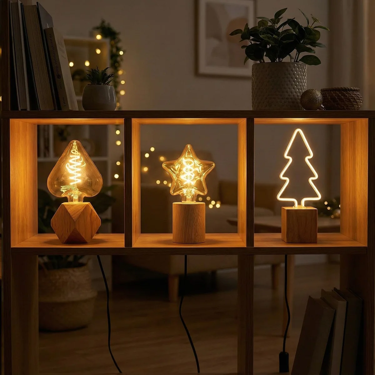 Set of three wood table lamps with natural wooden bases and decorative bulbs on a white surface with UK plugs visible
