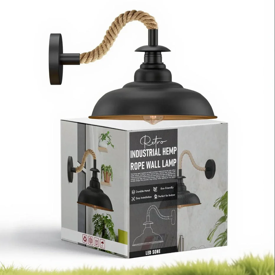 Black wall sconce with 32cm curvy black metal shade and twisted natural hemp rope cable mounted on wall indoors