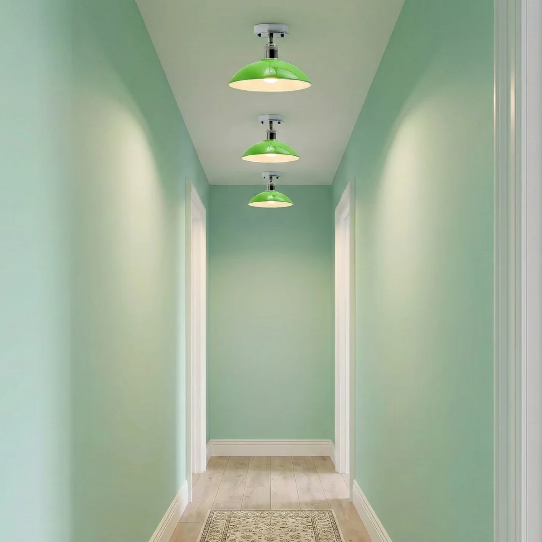 Green pendant light with glossy green metal shade and chrome hardware, semi-flush mount ceiling fixture with white interior
