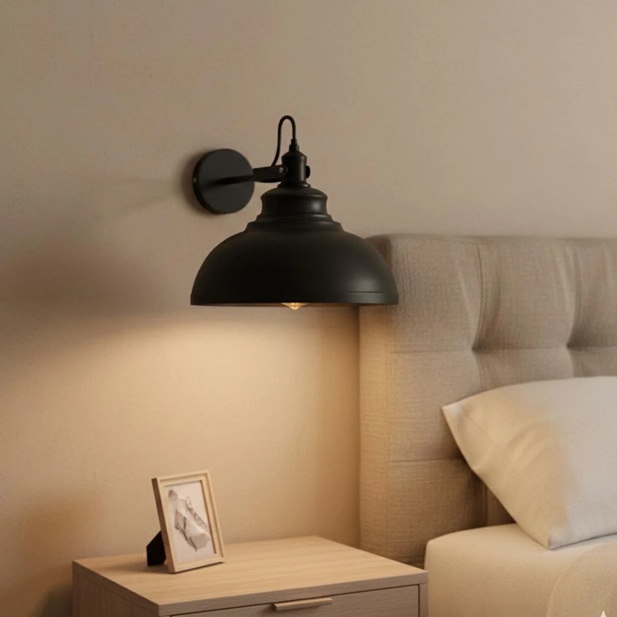 Adjustable industrial wall light with matte black curved metal arm and wide 29 cm dome shade mounted on wall