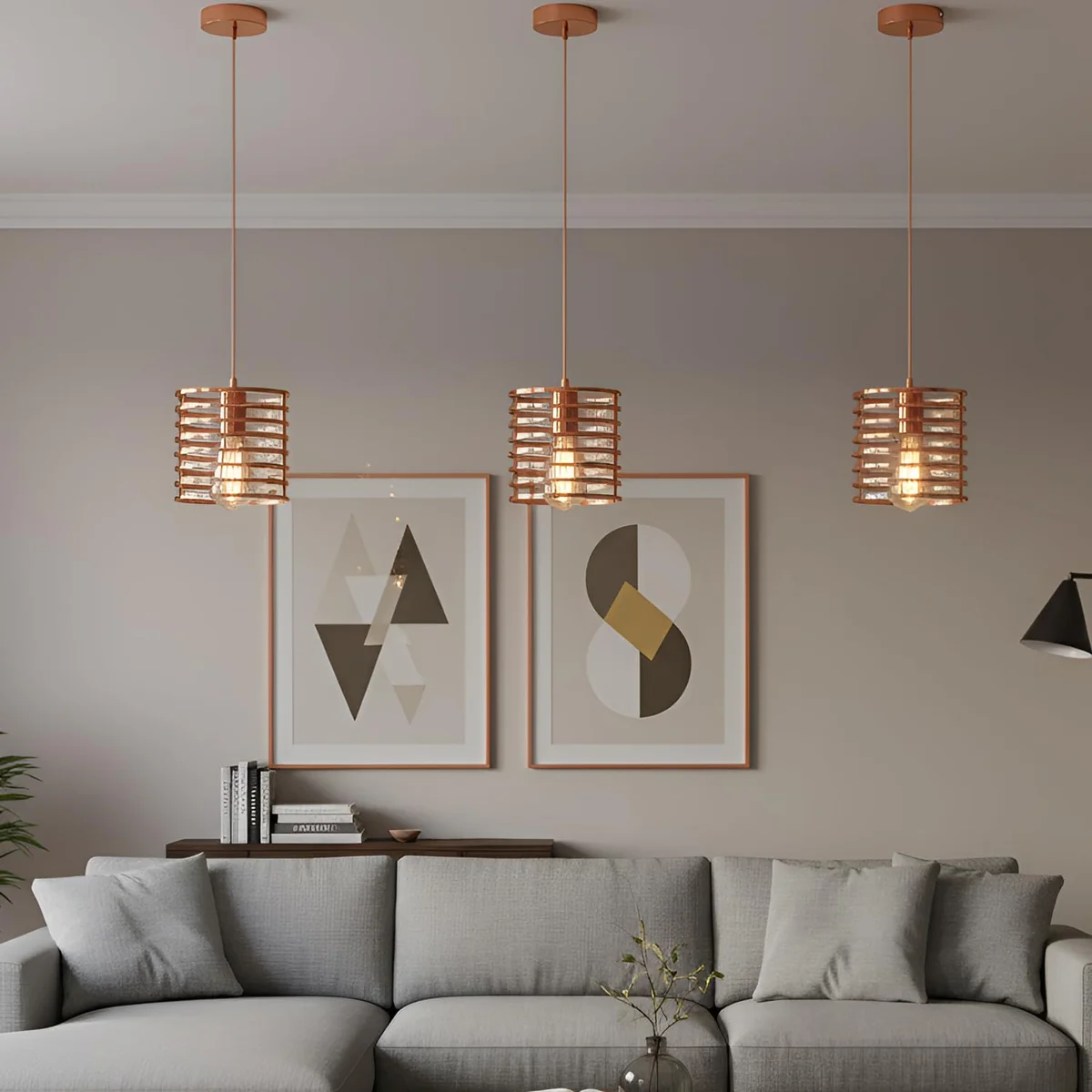 Triple head rose gold metal cage kitchen island pendant light with adjustable cords hanging from ceiling