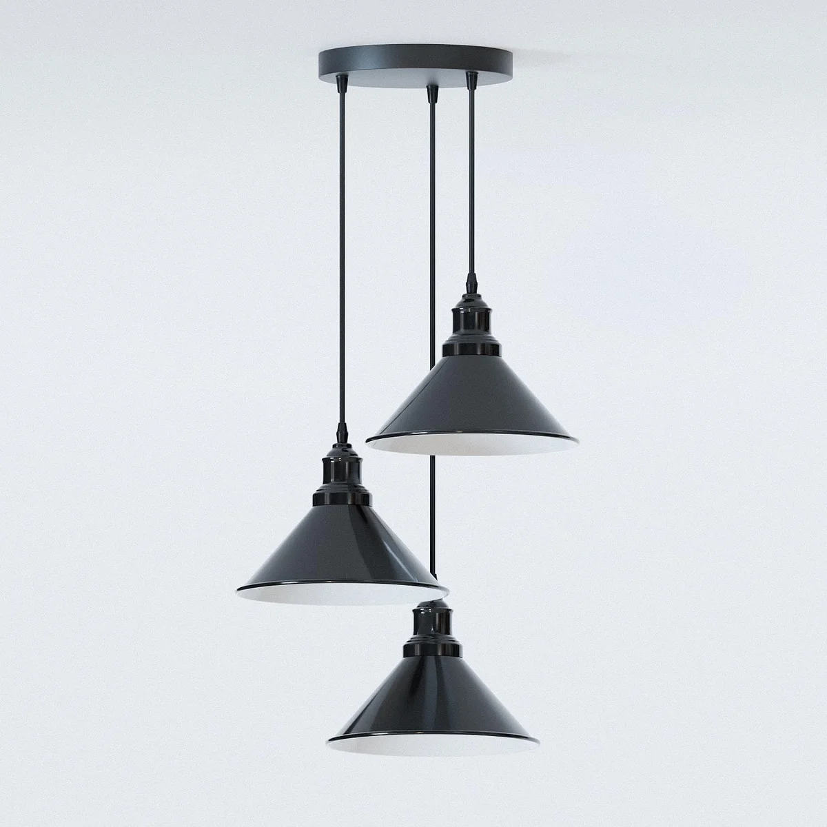 Black industrial 3-head pendant light with adjustable cables and white inner shades hanging from ceiling