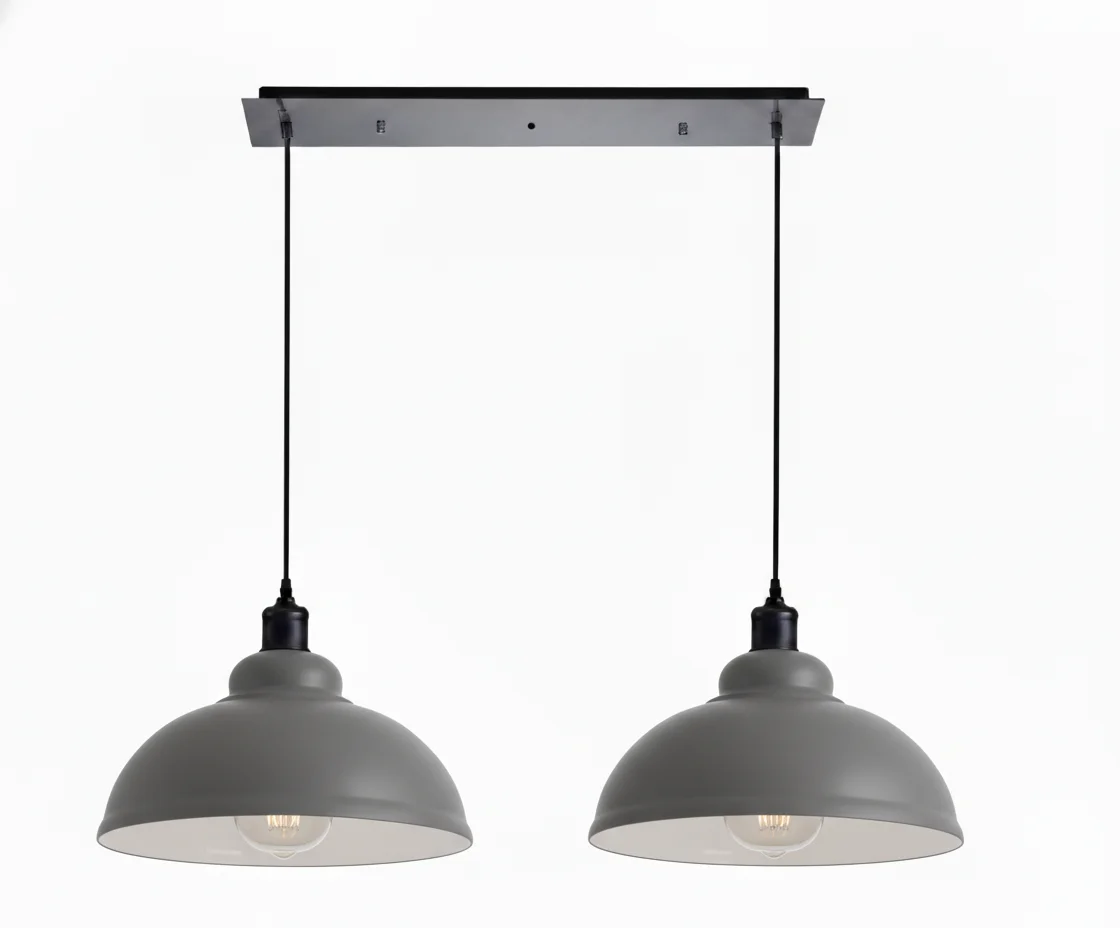 2 light dome pendant with two adjustable metal dome shades in brushed brass finish hanging from ceiling cords