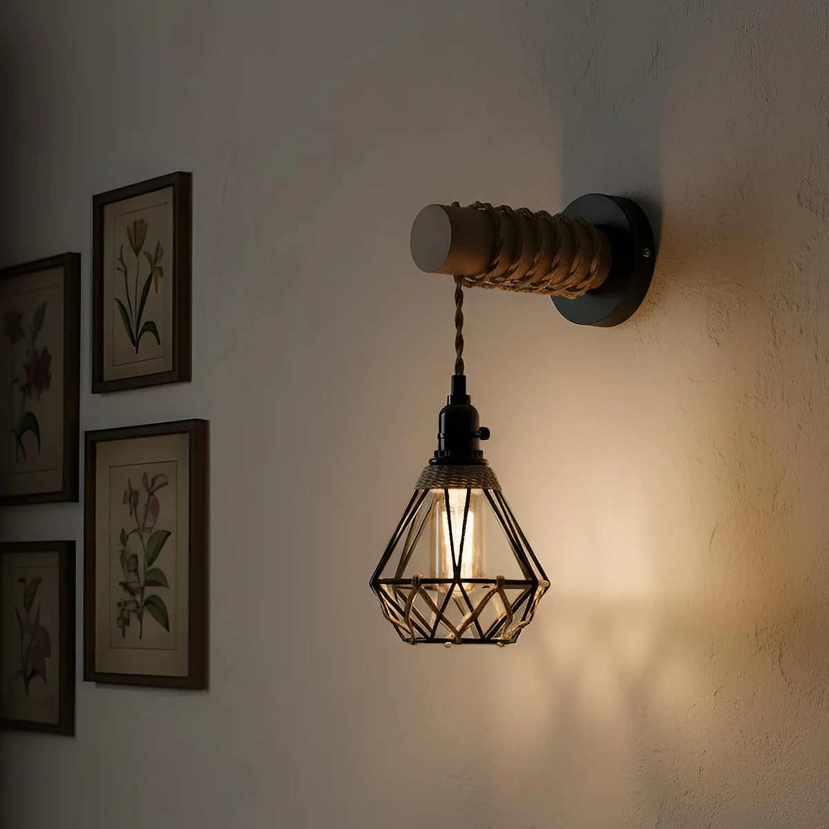 Rustic wall light with natural wood arm, black metal cage, and jute rope cable, mounted on a white wall background