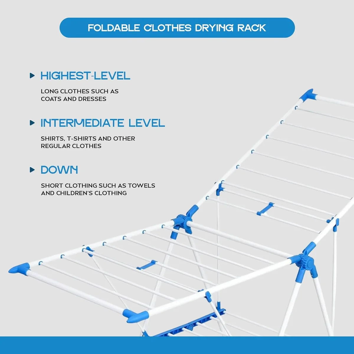 Foldable clothes drying rack in white and pink with three tiers, holding shirts, towels, and socks indoors