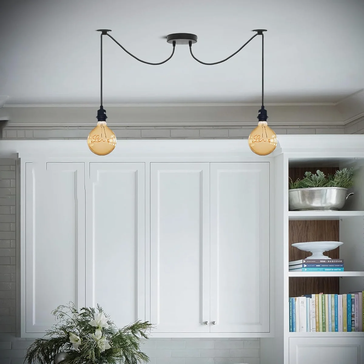 Black metal pendant with two exposed bulbs and adjustable cables in a modern industrial spider design hanging from ceiling