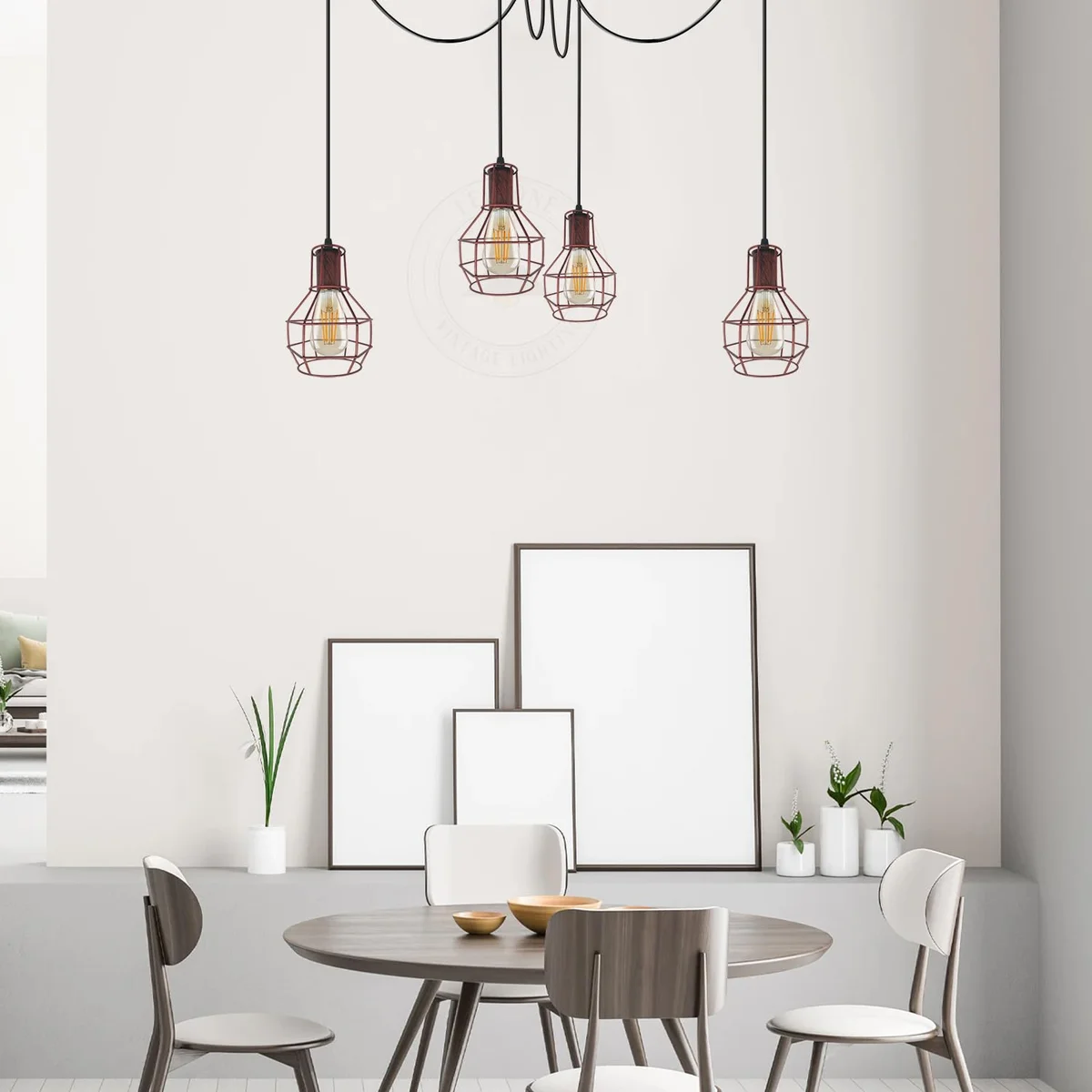 Industrial vintage chandelier with spider-shaped metal frame and classic wire cage lampshades, shown in warm indoor setting