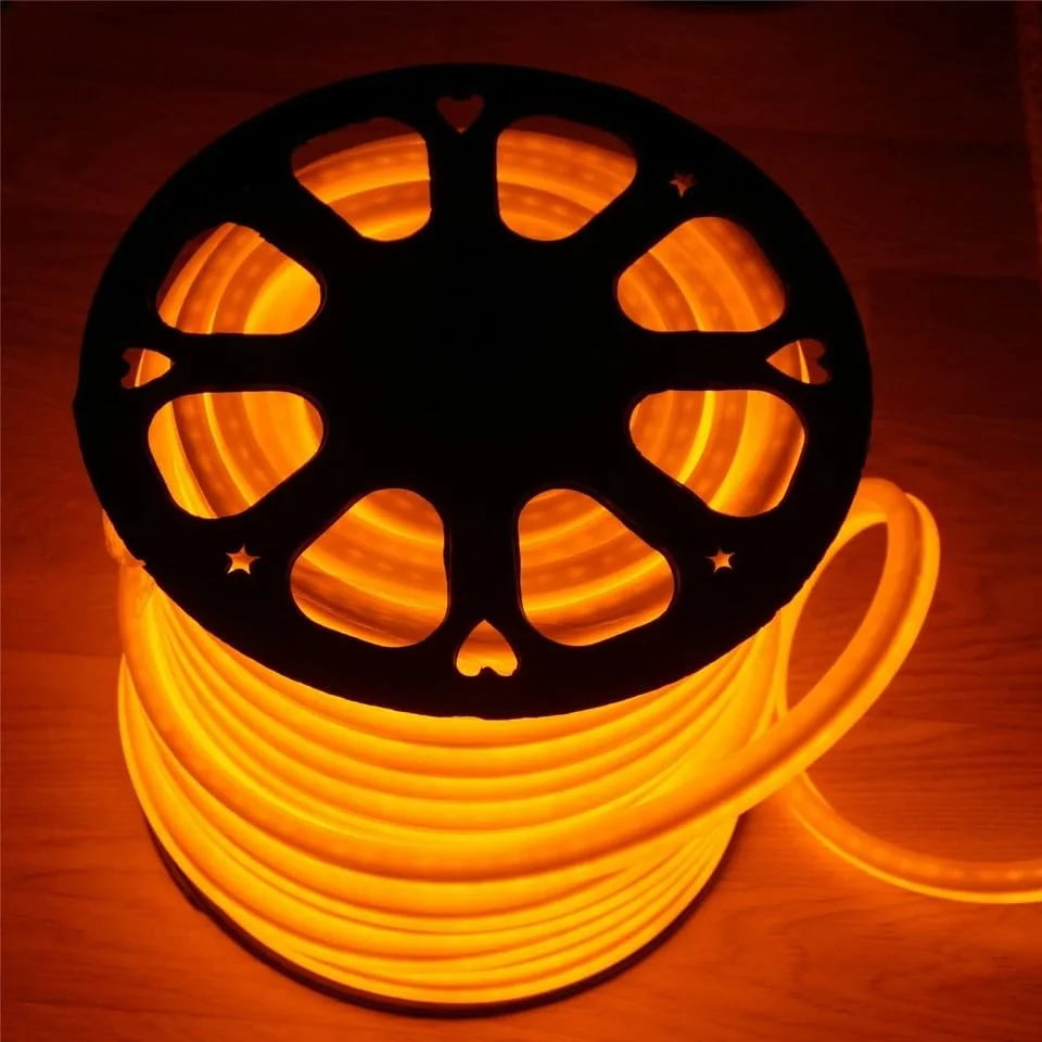 Three flexible neon LED strip lights glowing orange-red, coiled and waterproof for indoor and outdoor use