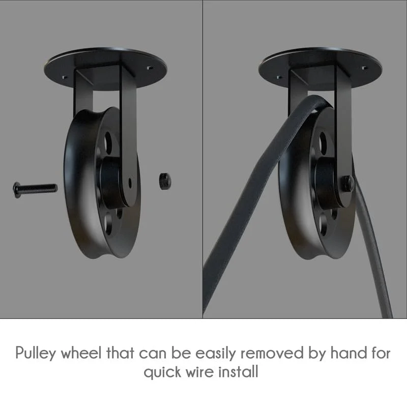 Set of black pulley wheels for pendant lights showing metal construction and mounting hardware on white background