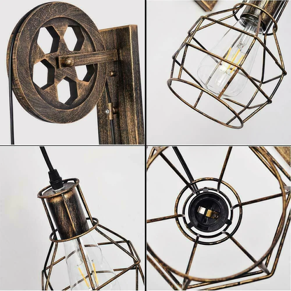 Brushed copper pulley wheel light with metal cage shade hanging from adjustable cable in industrial style