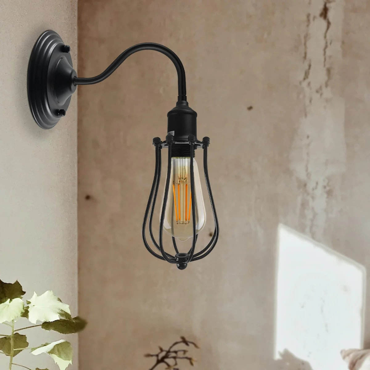 Vintage wall sconce with metal dome shade, curved swan neck arm, and wall-mounted industrial design in matte finish