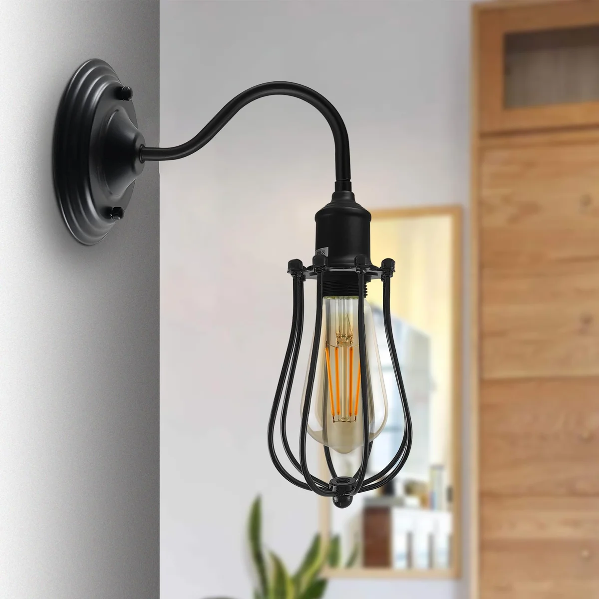 Vintage wall sconce with curved metal dome shade and swan neck arm, ideal for indoor wall mounting in industrial style