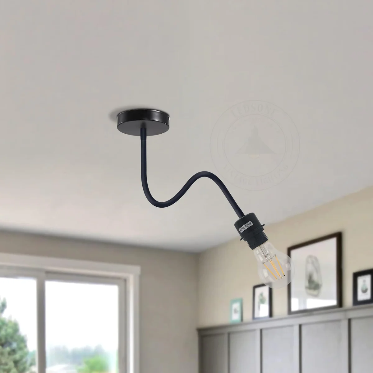 Flexible bedside reading light with adjustable 34.5cm swan neck arm in matte black metal finish mounted on wall