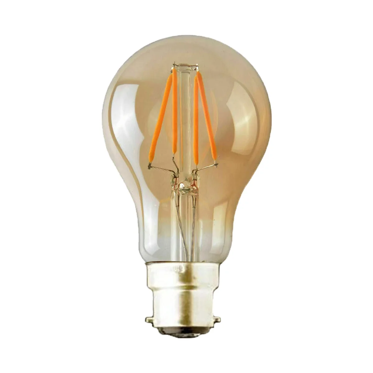 Two vintage Edison bulbs with B22 bayonet caps glowing warm white light on a dark background