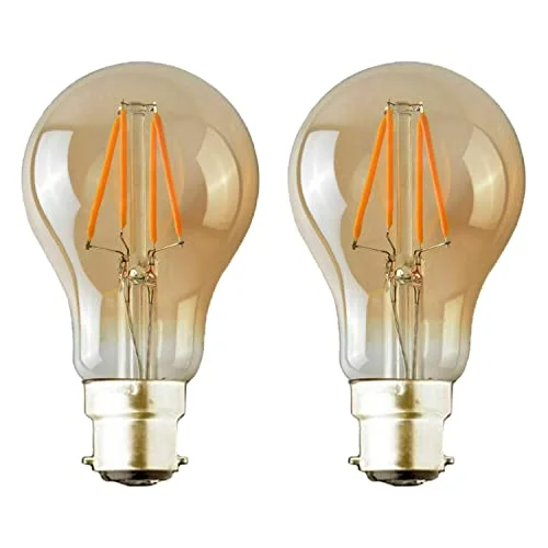 Three warm white LED bulbs with B22 bayonet caps glowing softly in a vintage Edison style against a white background