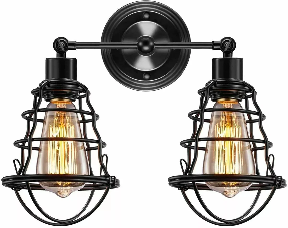 Industrial double head wall light with two black metal cage lamps and circular decorative backplate in vintage style