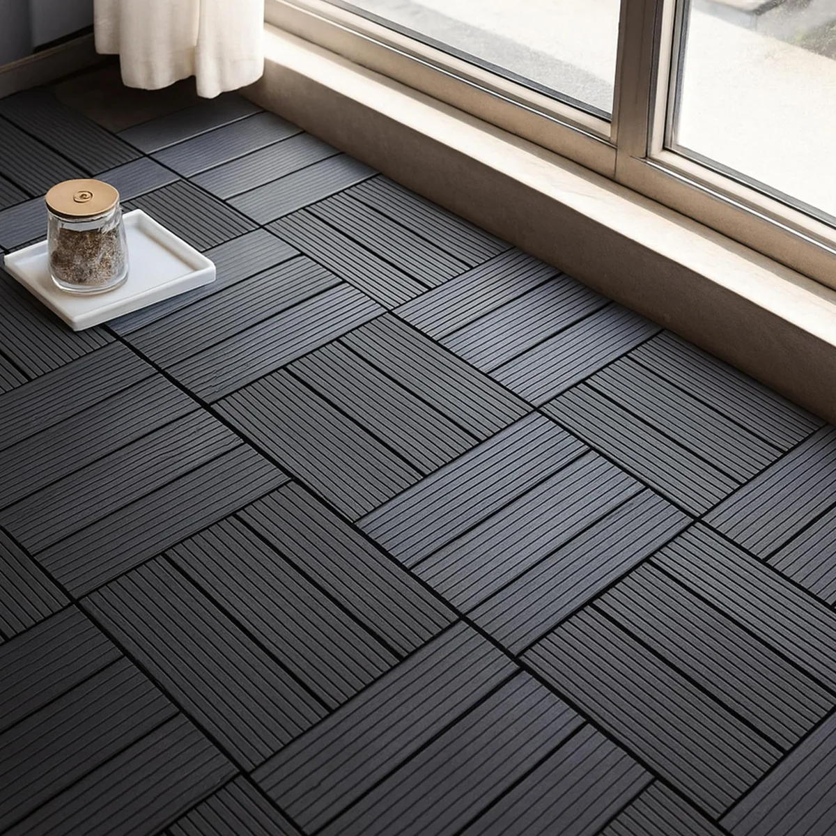 Easy installation deck tiles in anthracite, showing interlocking square tiles with hollow base.