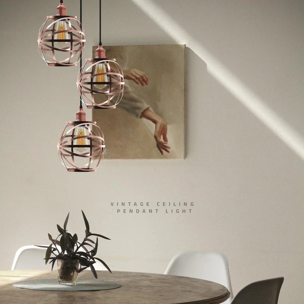 Three-headed industrial pendant light with metal cage shades, adjustable cable, and ceiling rose in matte finish
