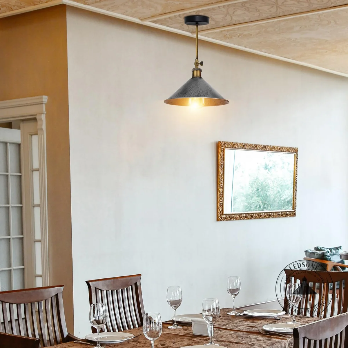 Vintage wall light with antique cone-shaped metal shade and arm, suitable for indoor wall mounting in retro style rooms